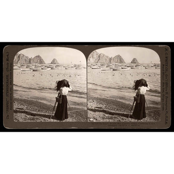 A vintage stereograph image of a photographer on the beach in Avalon Bay, Catalina Island