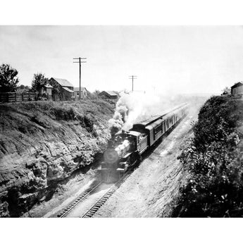 A vintage photograph of a railroad train in black and white