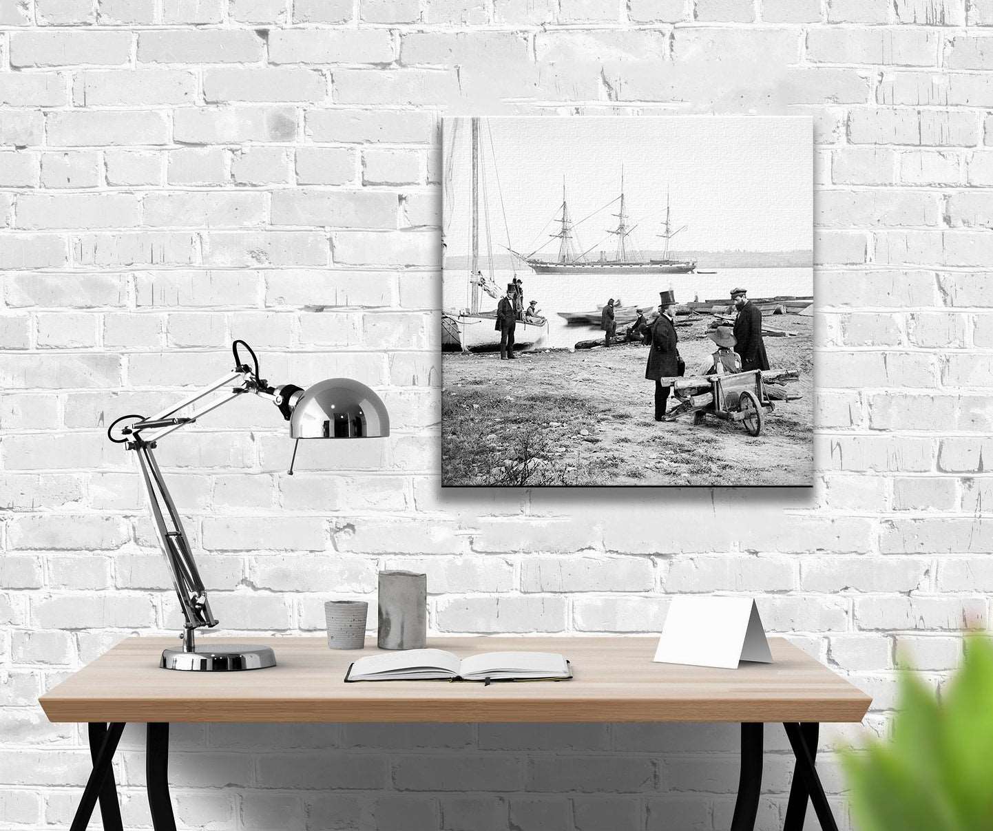 A digital rendering of a room with a canvas print of a vintage photograph of the Steam Frigate Pensacola