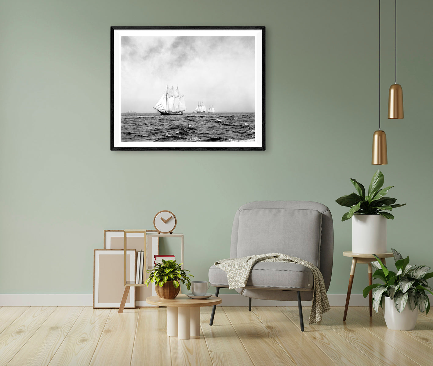 A green living room wall with a framed print on paper of a vintage image of sailing ships