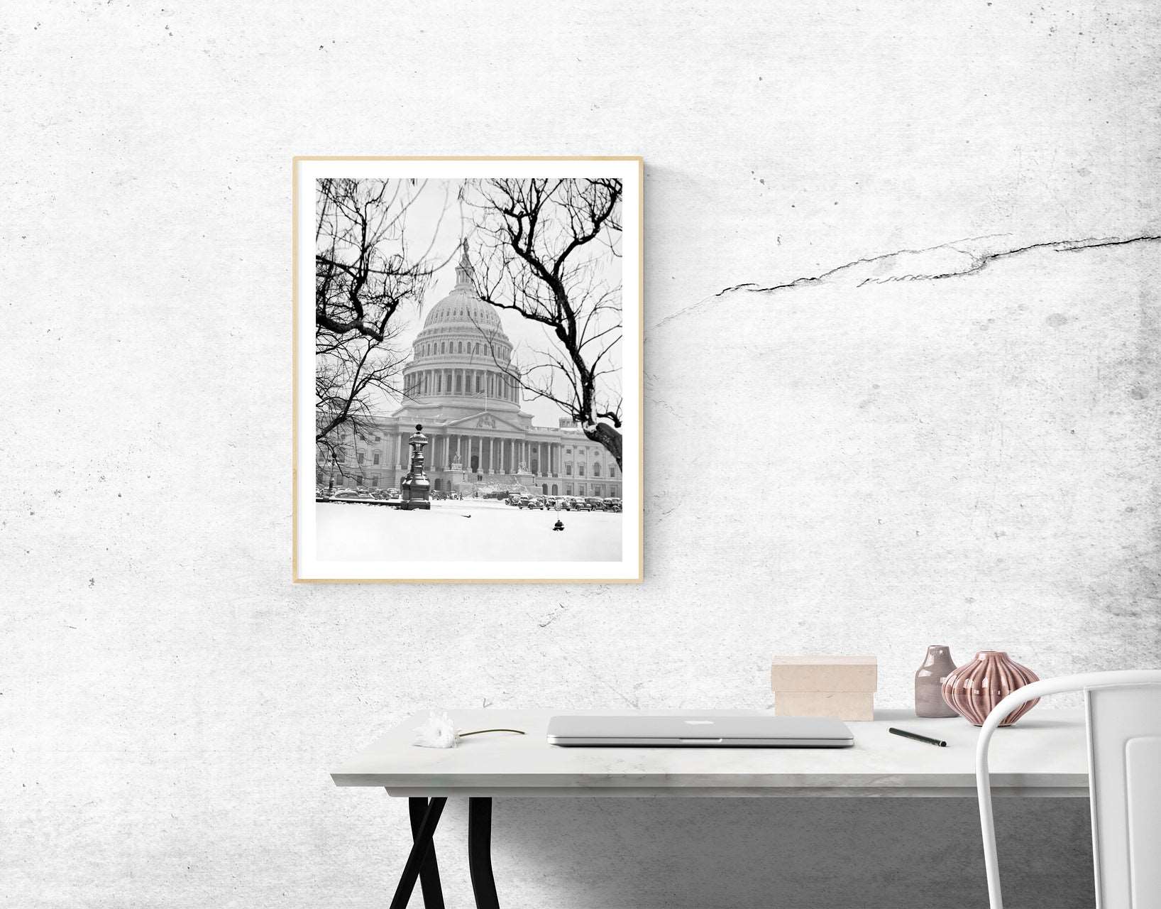 A framed print reproduction of a vintage photograph of the US Capitol in winter