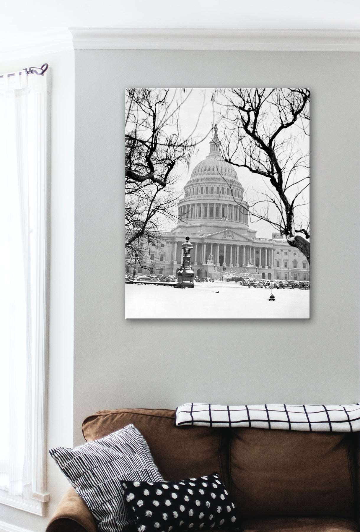 A living room wall with a canvas print of the US Capitol on the wall