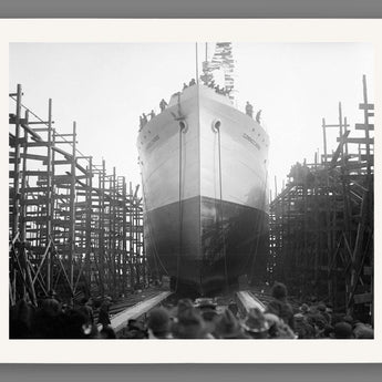 A paper print of a black and white photograph of a ship launch in Virginia
