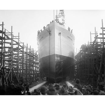 A black and white, vintage photograph of a ship being launched in Virginia