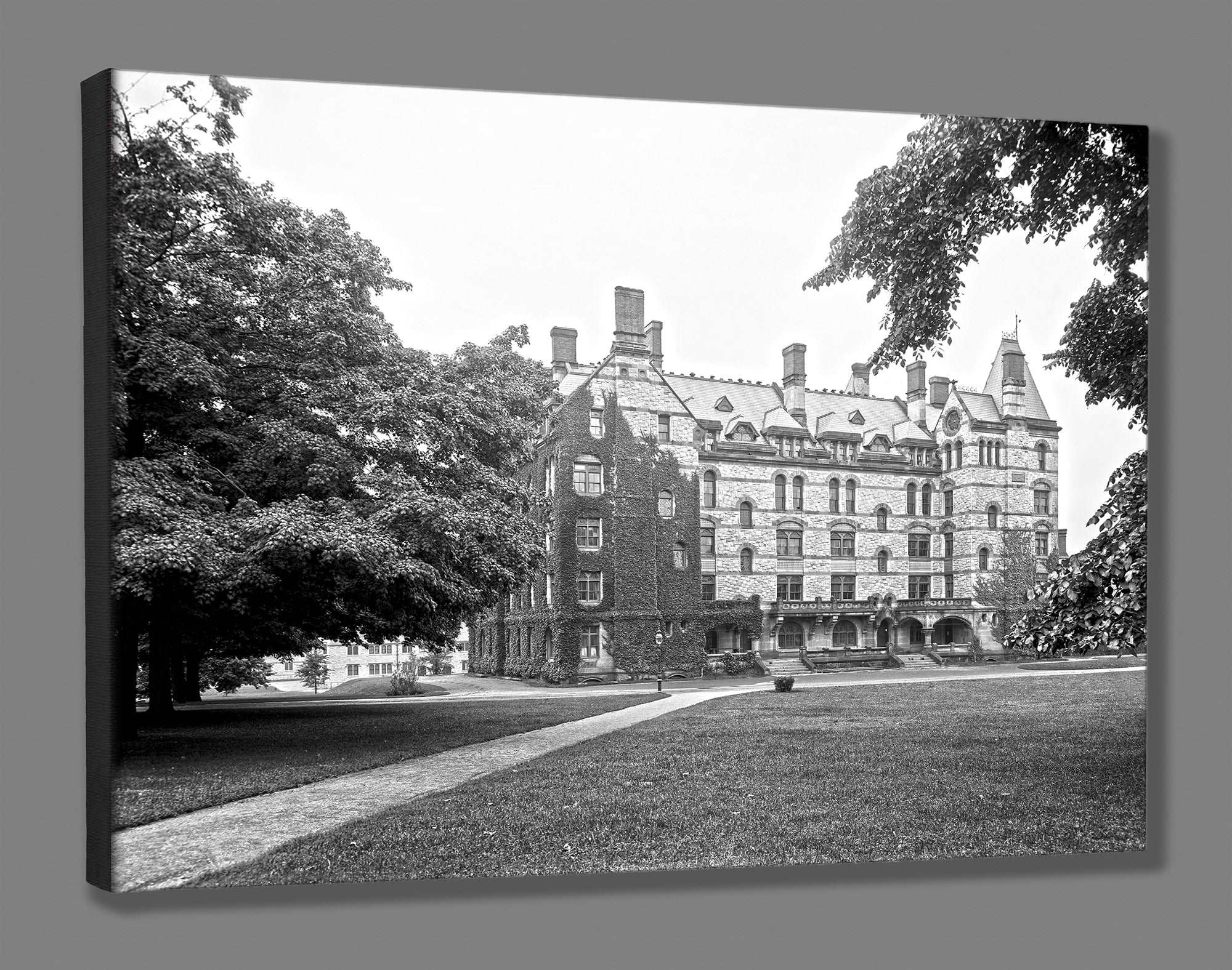 A canvas print mockup of a black and white photograph of Witherspoon Hall at Princeton University