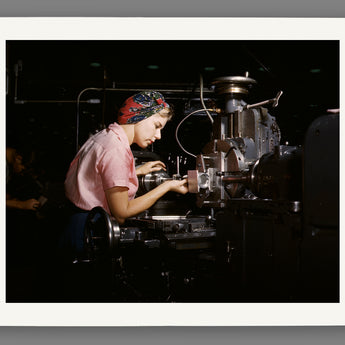 Paper print reproduction mockup of a vintage photo of a woman working at Douglas Aircraft Company