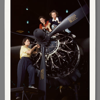 Mockup of a paper print of a color photograph of women working on a C-47