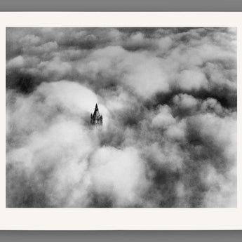 A digital mockup of a paper print featuring our vintage photograph of Woolworth Tower above the clouds