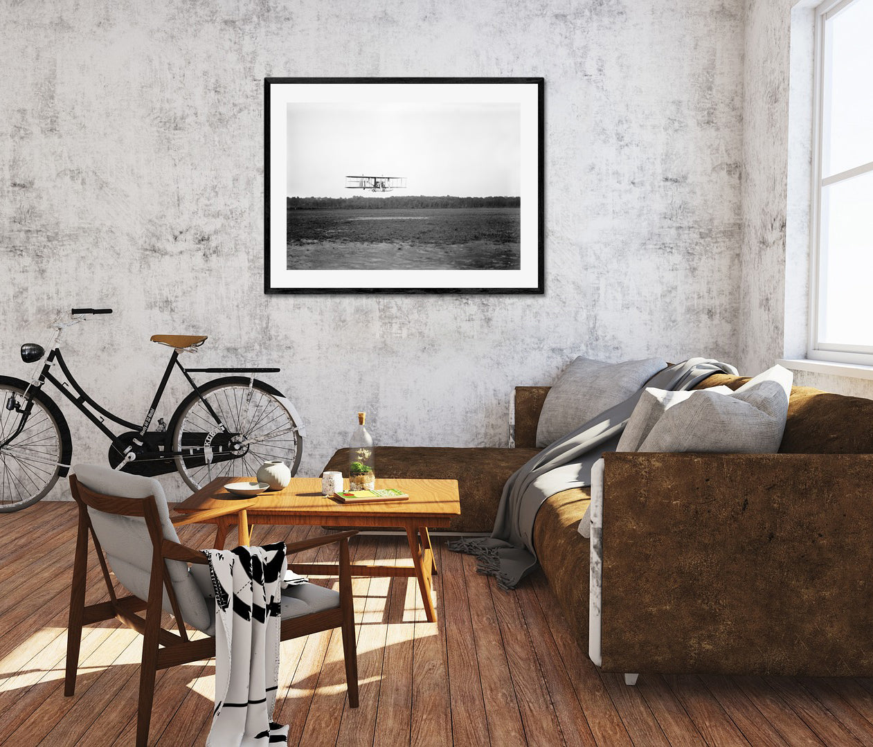 A living room with a framed paper print of a vintage photograph of a Wright Biplane